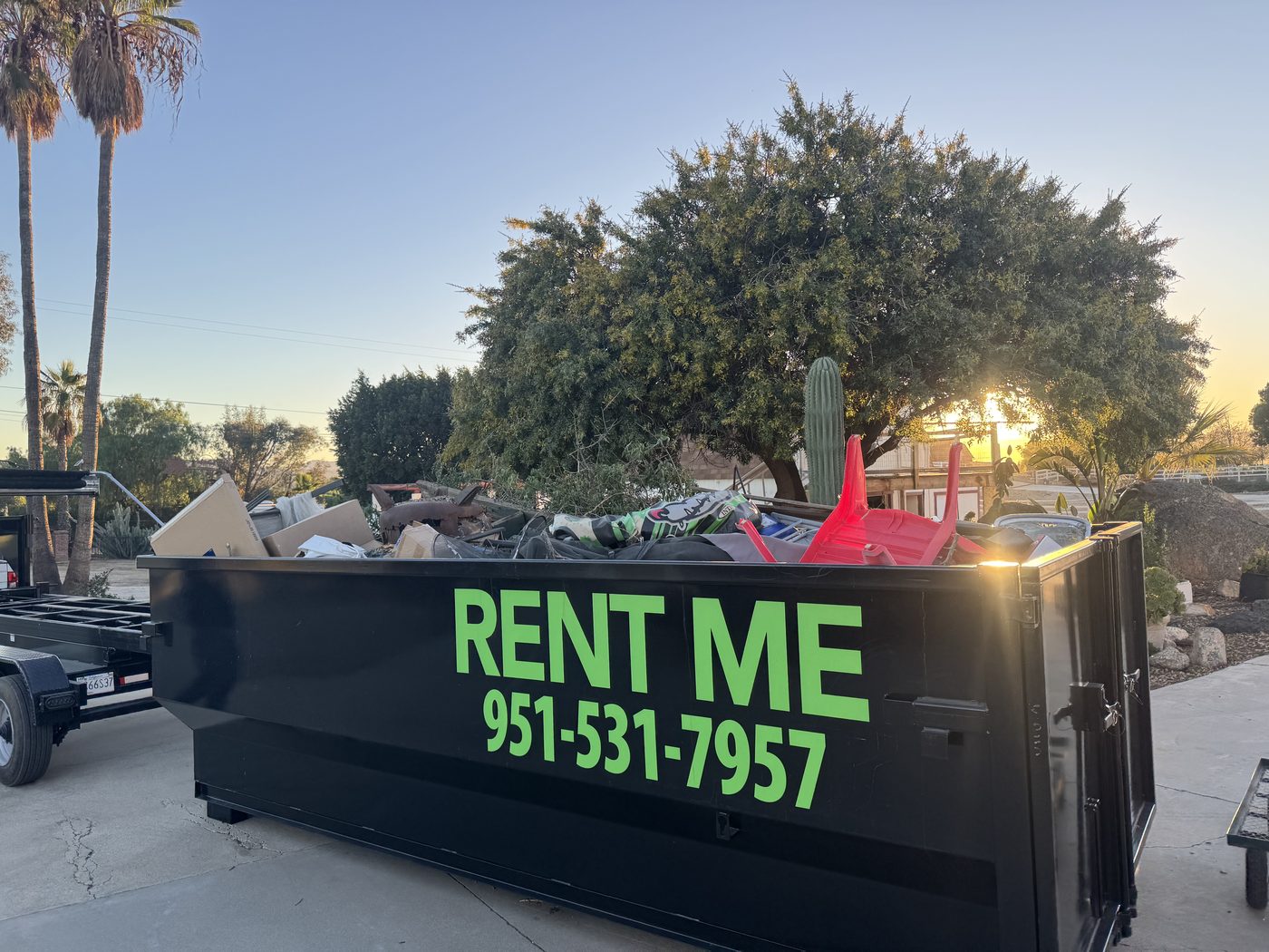 Green roll-off dumpster
